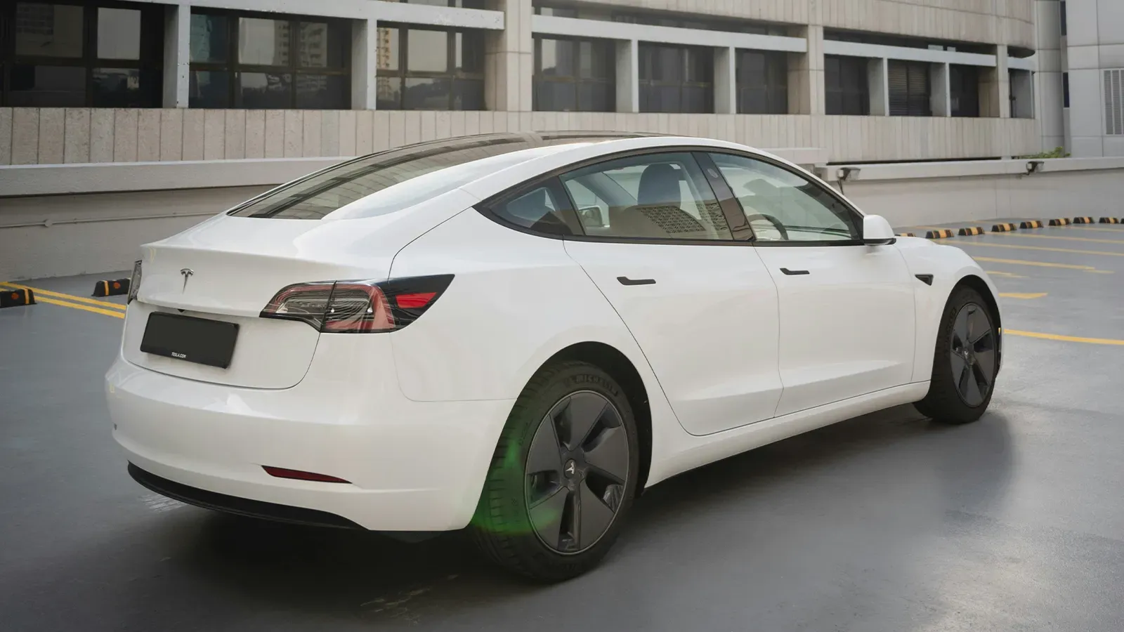 white used Tesla Model 3 EV sedan