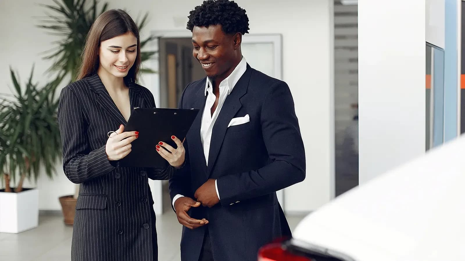 Woman and man looking at tablet together