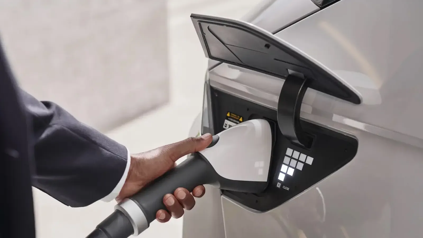 Man charging Hyundai EV closeup