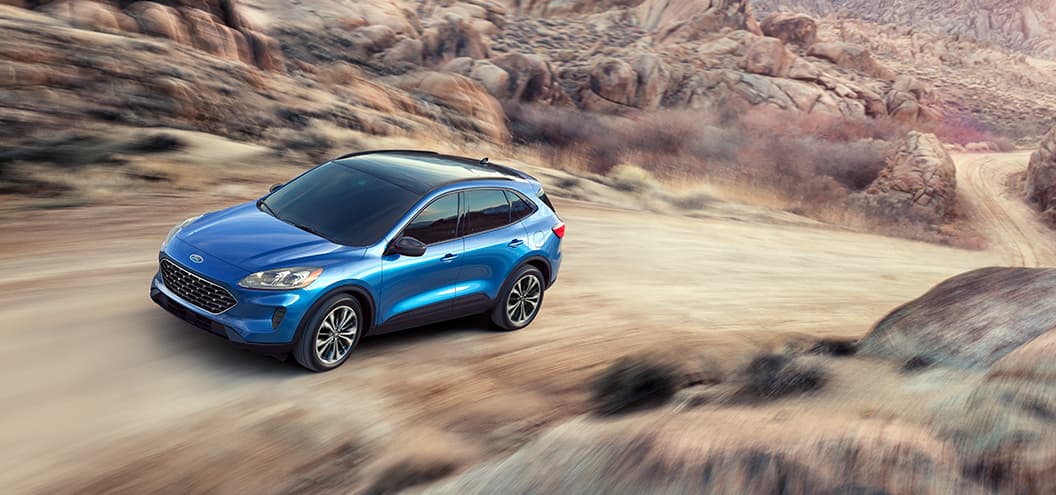 2019 Blue Ford Escape Hybrid Traveling in Desert