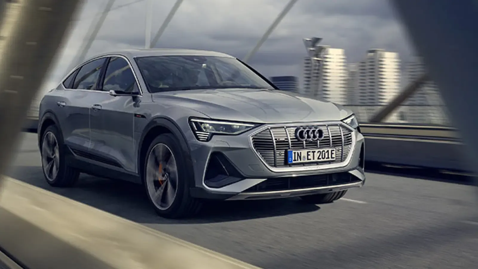 2021 Audi e-tron Sportback driving over bridge in city