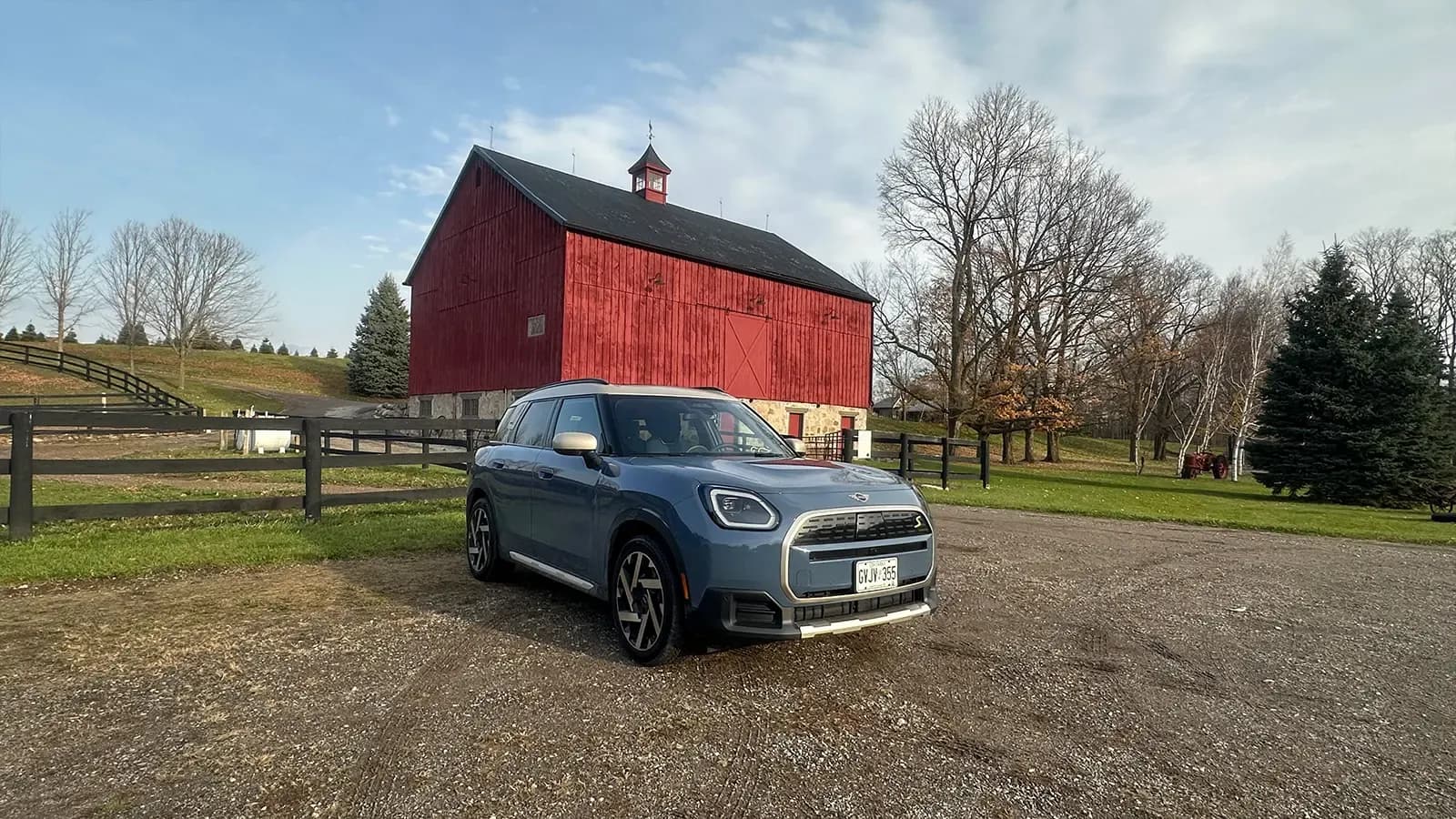 blue Countryman parked at a barn
