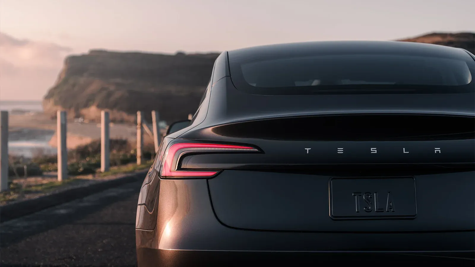 rear view of black Tesla Model 3 Highland