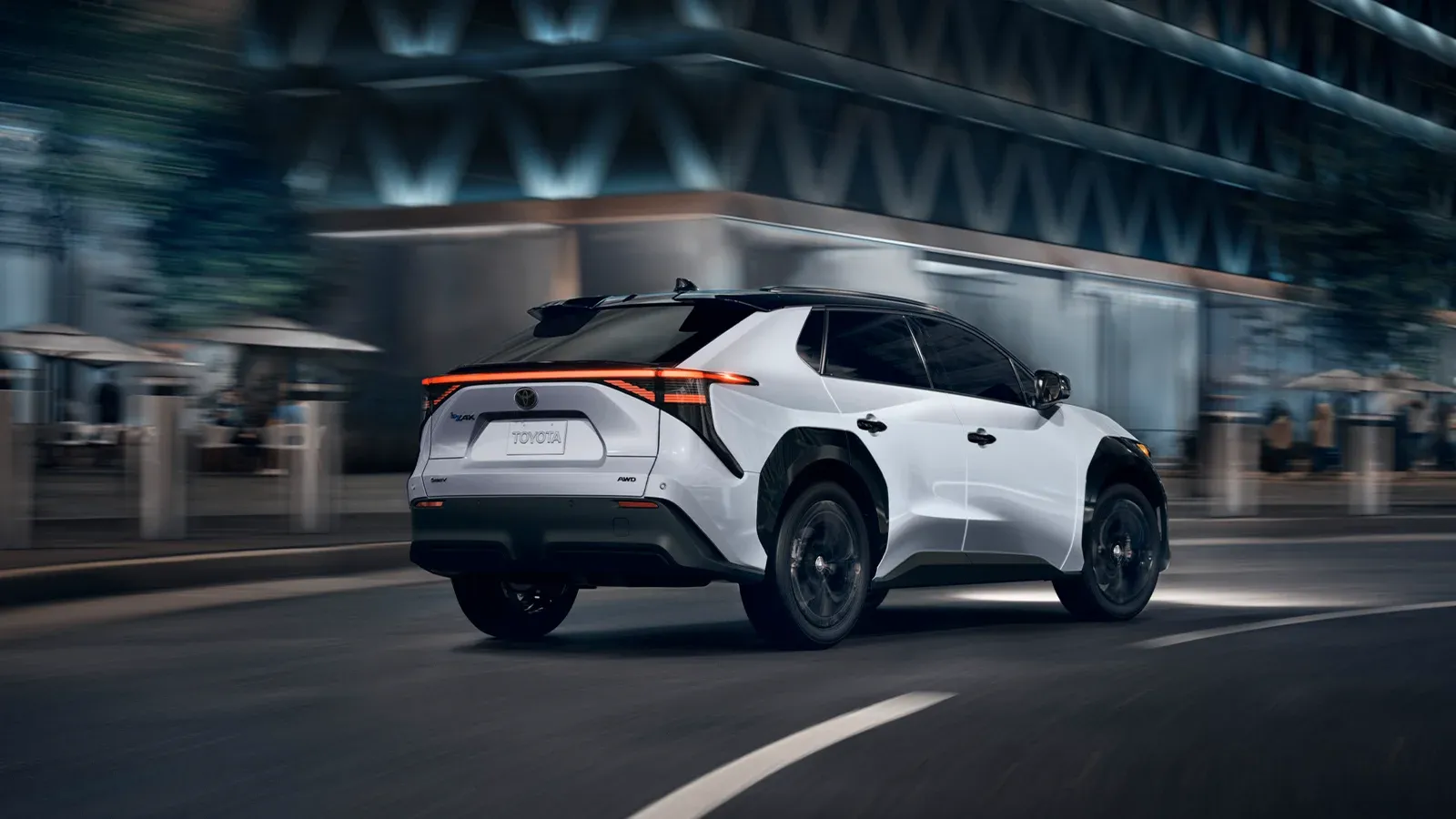 white Toyota bZ4X driving at night