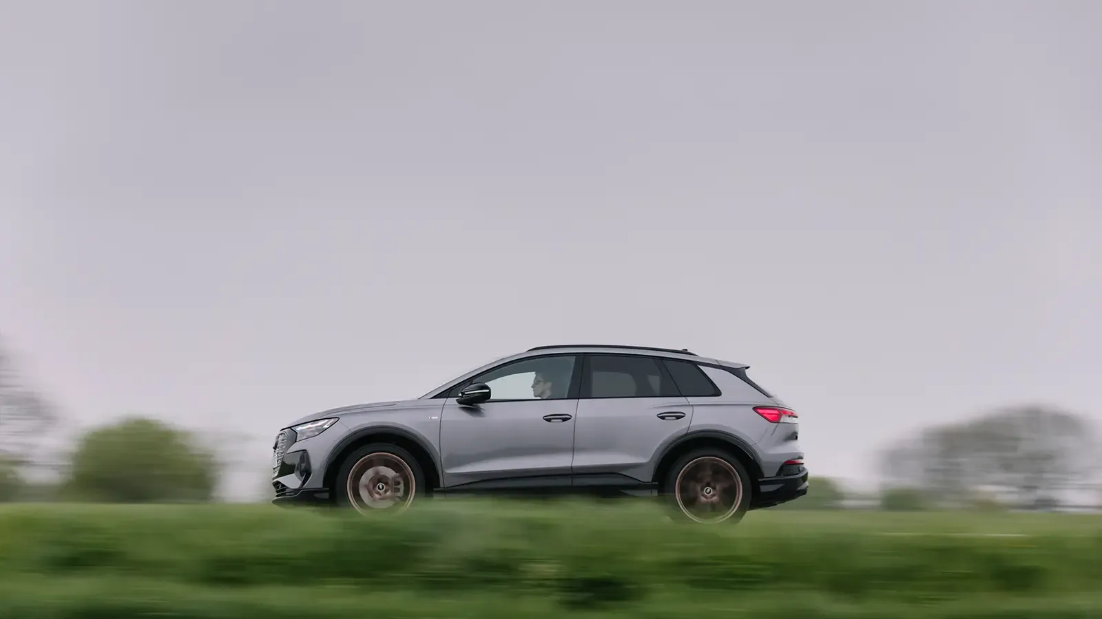2023 Audi Q4 e-tron driving down a country road
