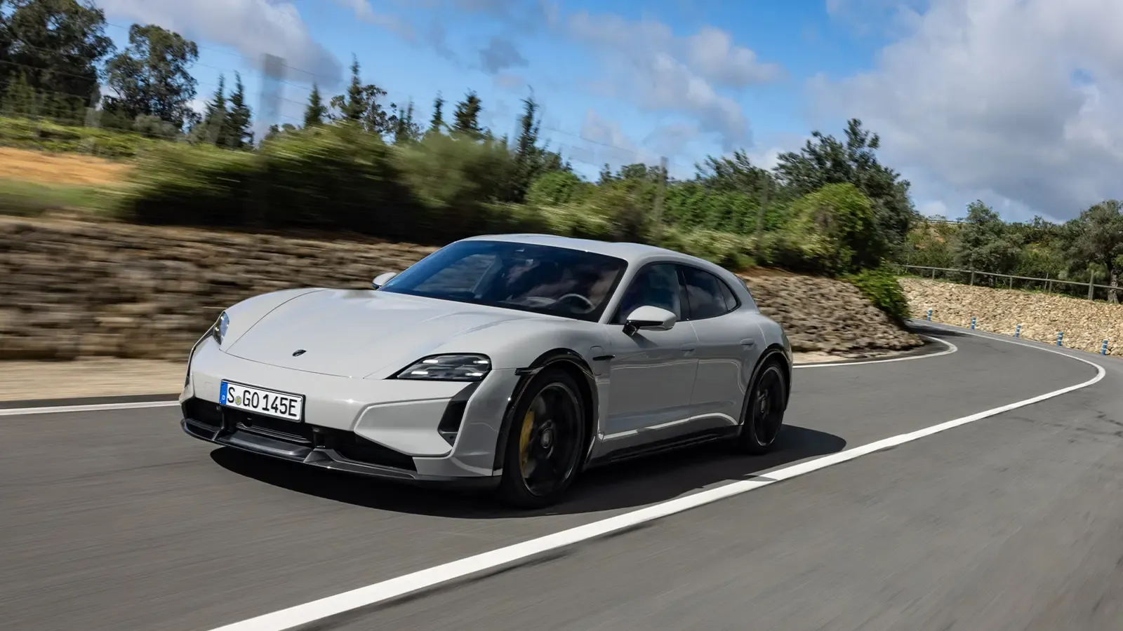 white Porsche Taycan on the road