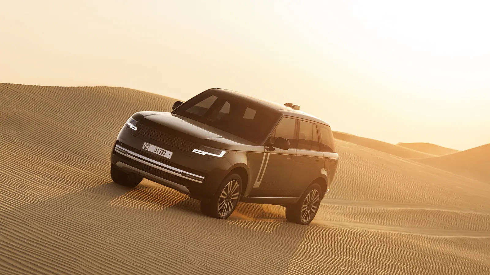 Black Range Rover Electric on Sand Dunes