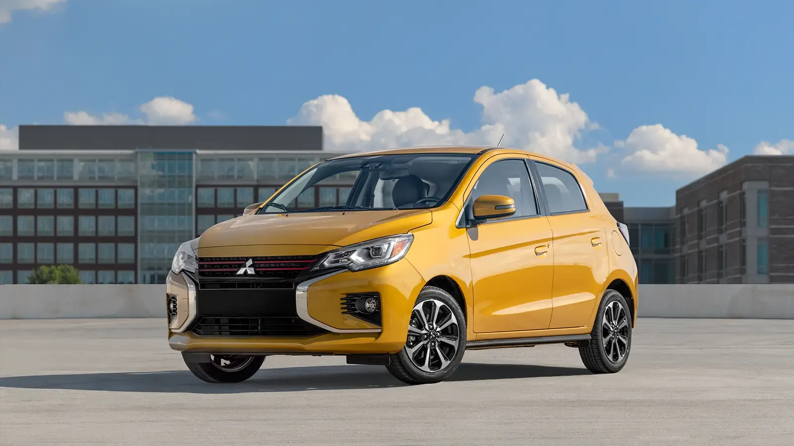 Yellow 2005 Mitsubishi Mirage parked in the city