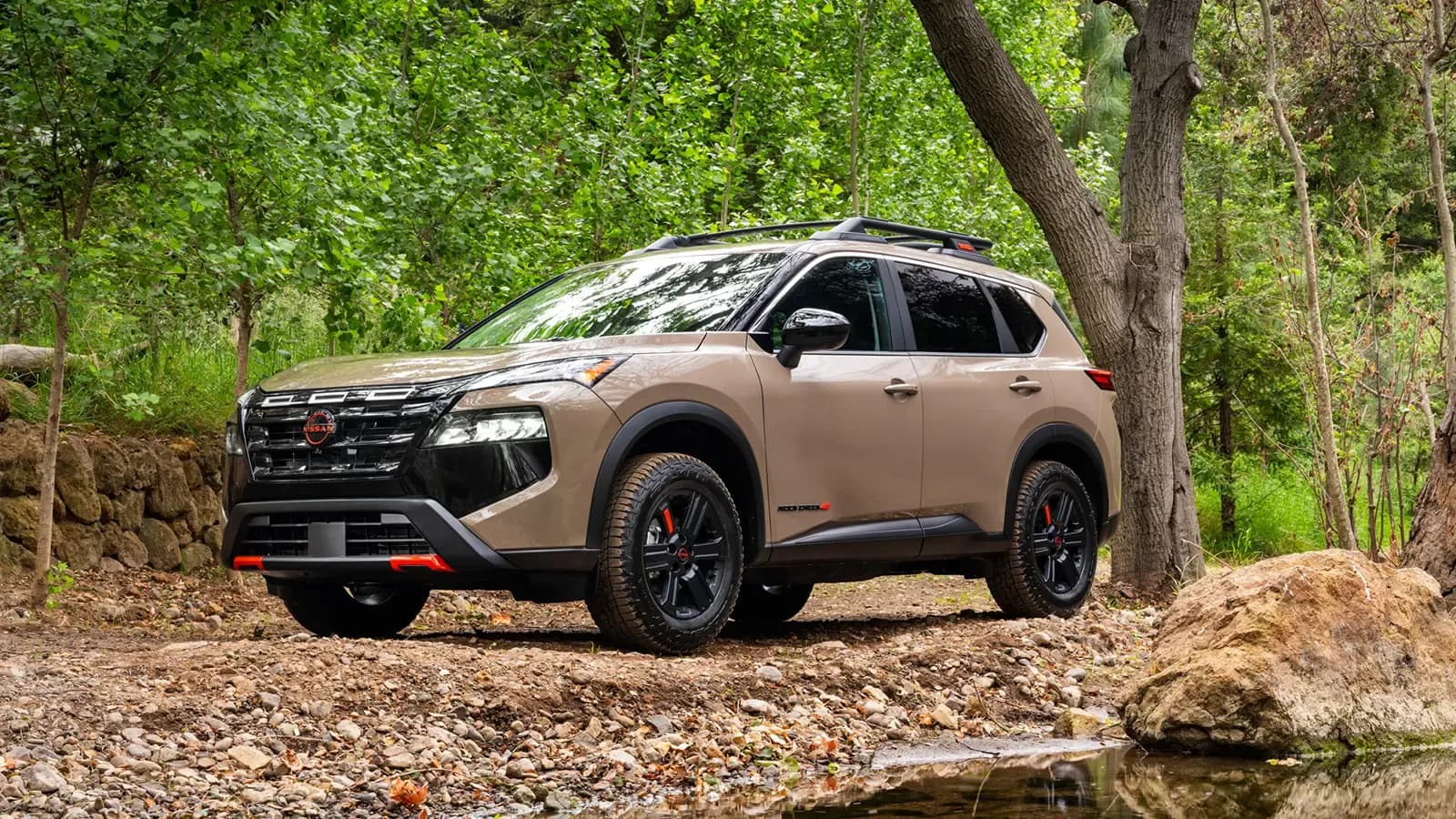 2025 Nissan Rogue in a forest.