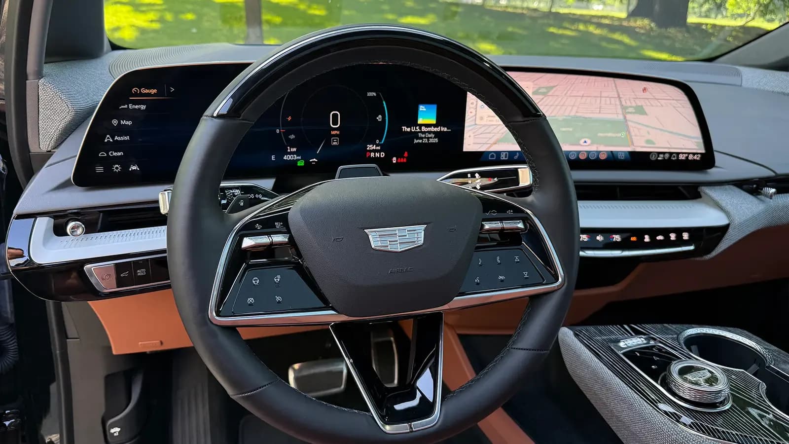 Cadillac Optiq interior with a steering wheel and wide digital dashboard display.