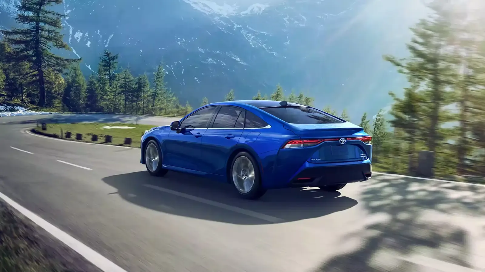 a Toyota Mirai on a road by the lake