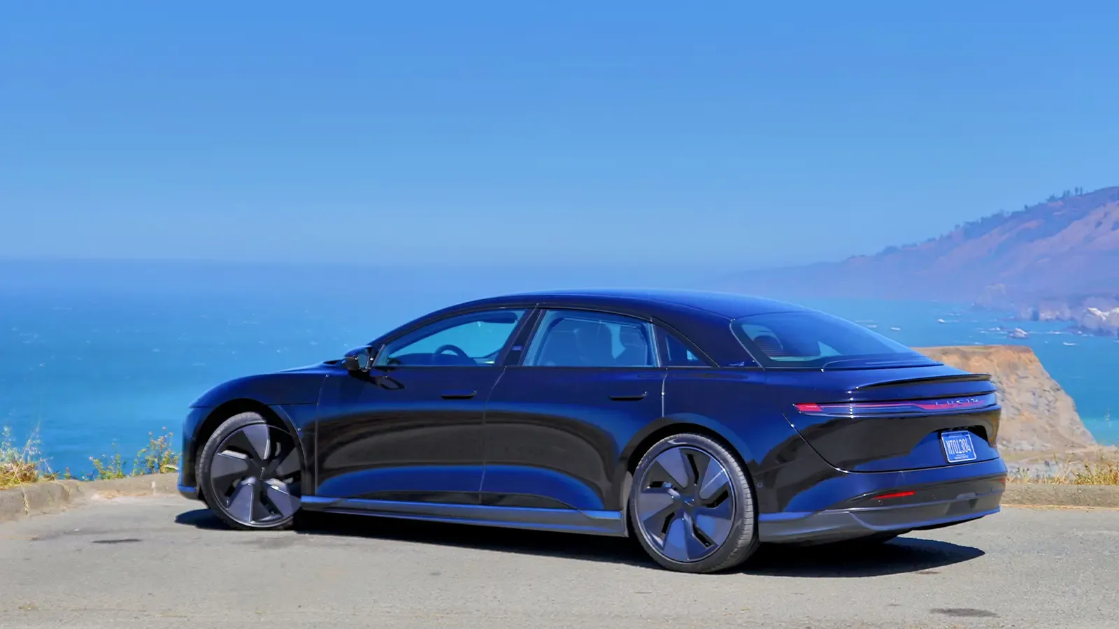 A black 2025 Lucid Air Grand Touring side view