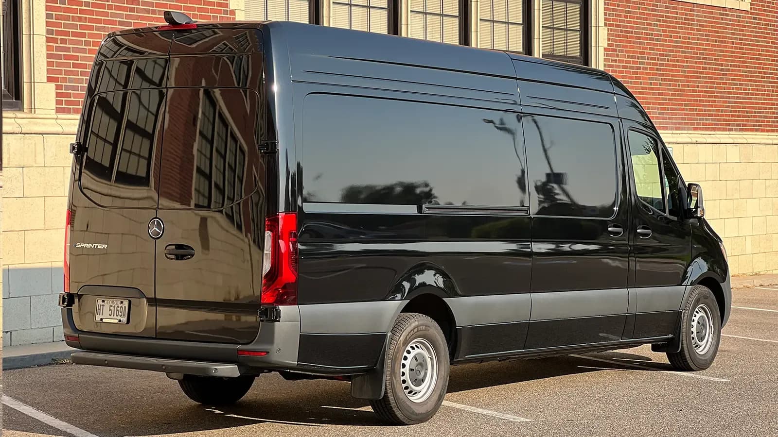 A black Mercedes eSprinter Cargo van 3 quarter-view
