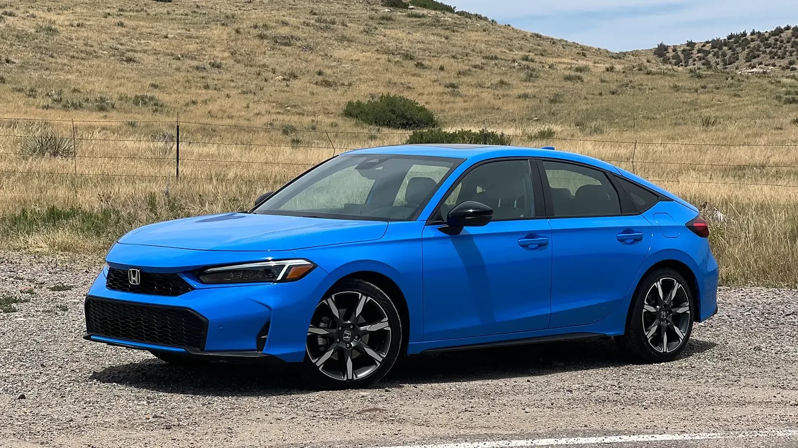 A blue 2025 Honda Civic Hatchback