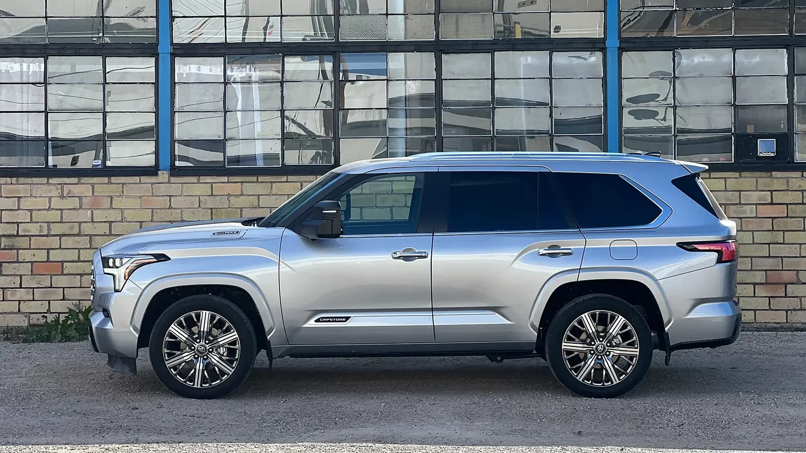 A silver 2026 Toyota Sequoia Hybrid Capstone side profile