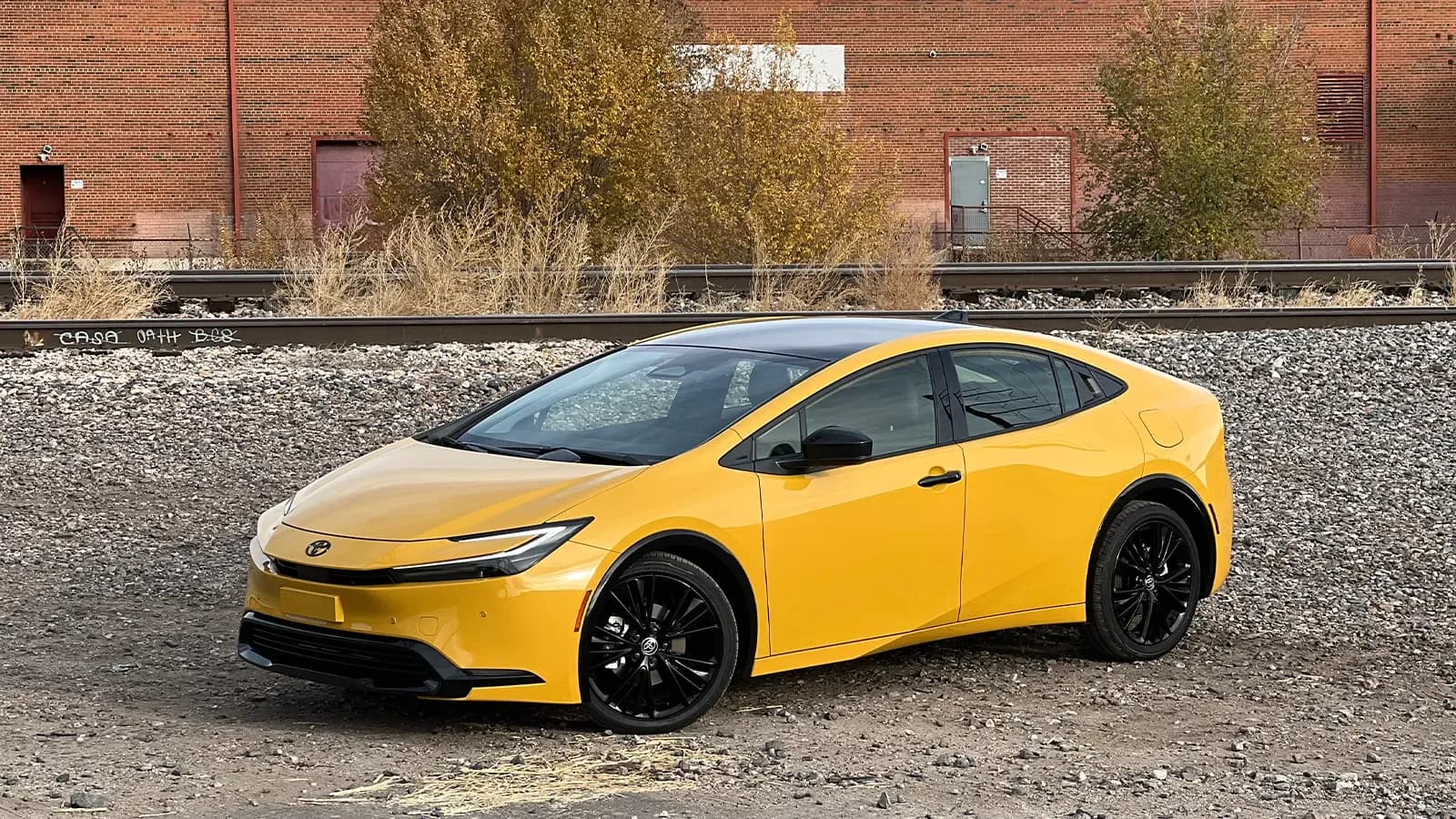 A yellow 2026 Toyota Prius XSE PHEV Nightshade