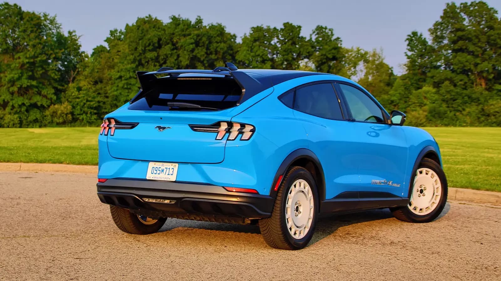 A blue 2026 Ford Mustang Mach-E rear three quarter view