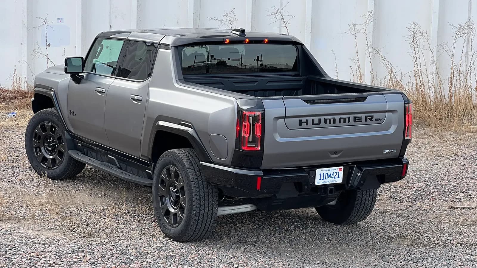 A dark gray 2026 GMC hummer EV pick up three quarter view