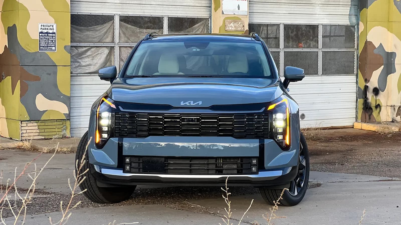 A dark blue 2026 Kia Sportage Hybrid SX Prestige front view