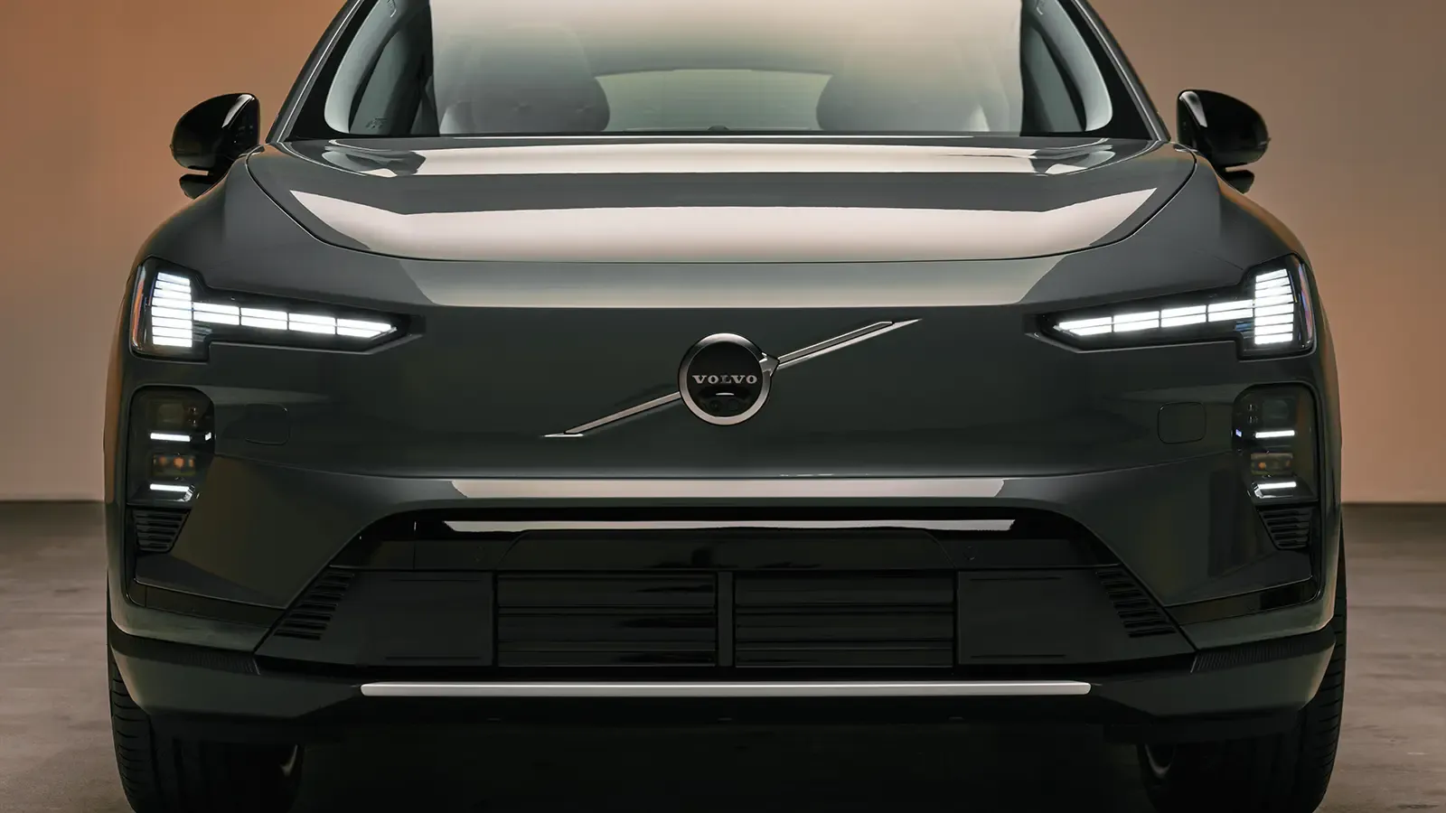 A dark gray 2027 Volvo EX60 front nose view