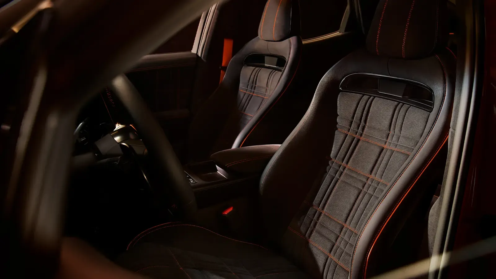 A 2027 Orange Genesis GV60 Magma interior driver front view
