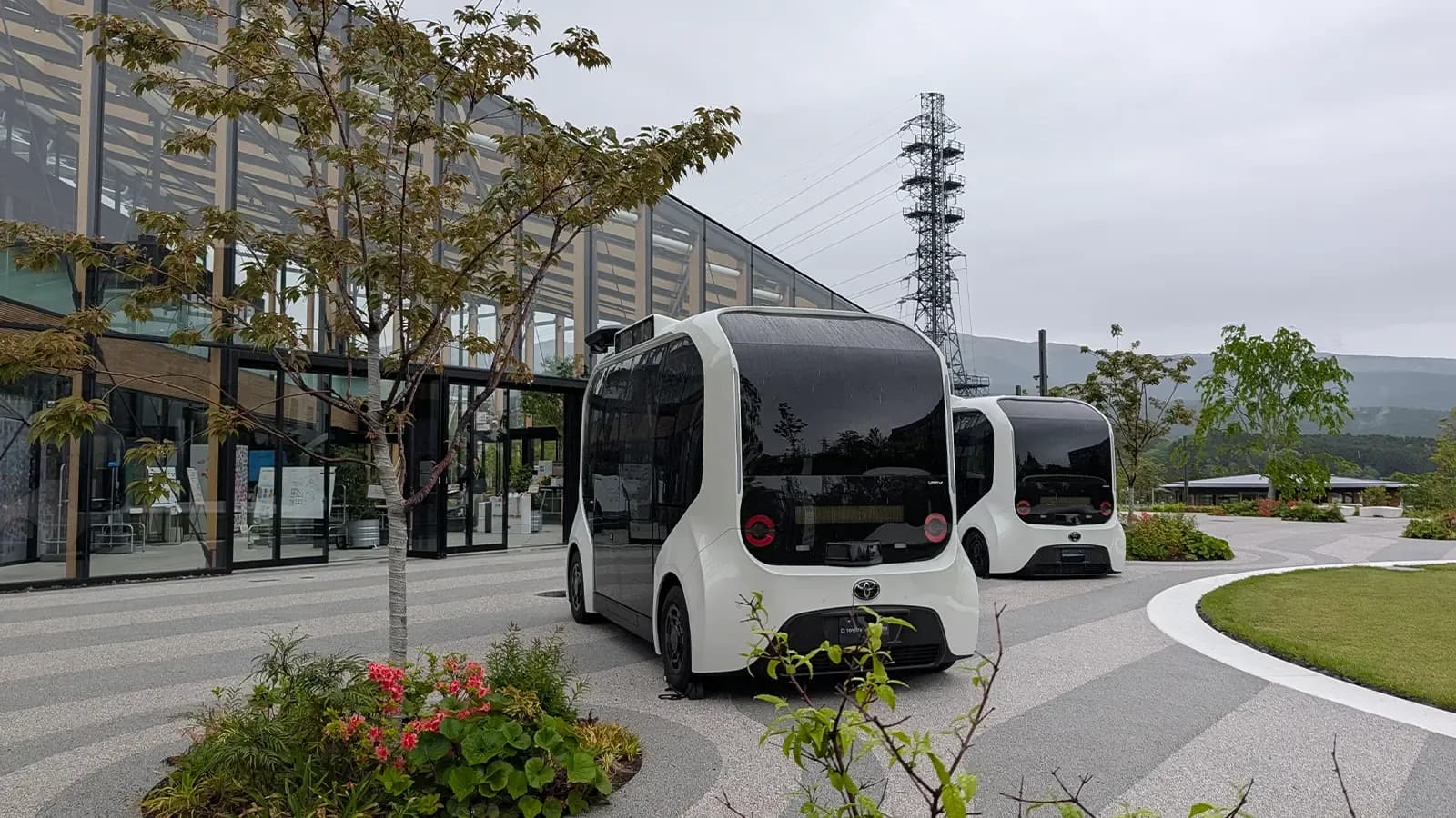 A front view of Toyotas woven city main entrances with buses